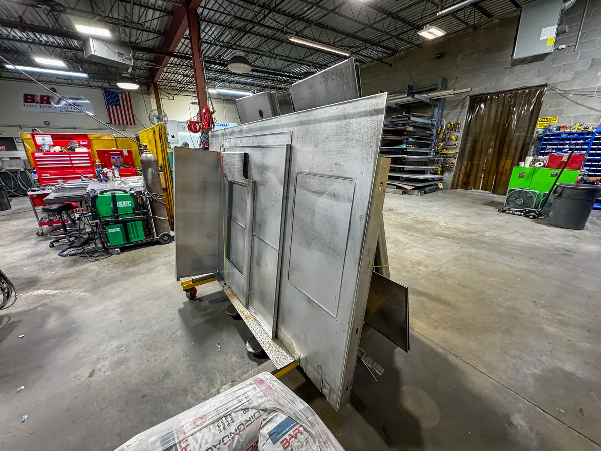 Open compartment with unfinished interior surfaces, photo 179 of 179.