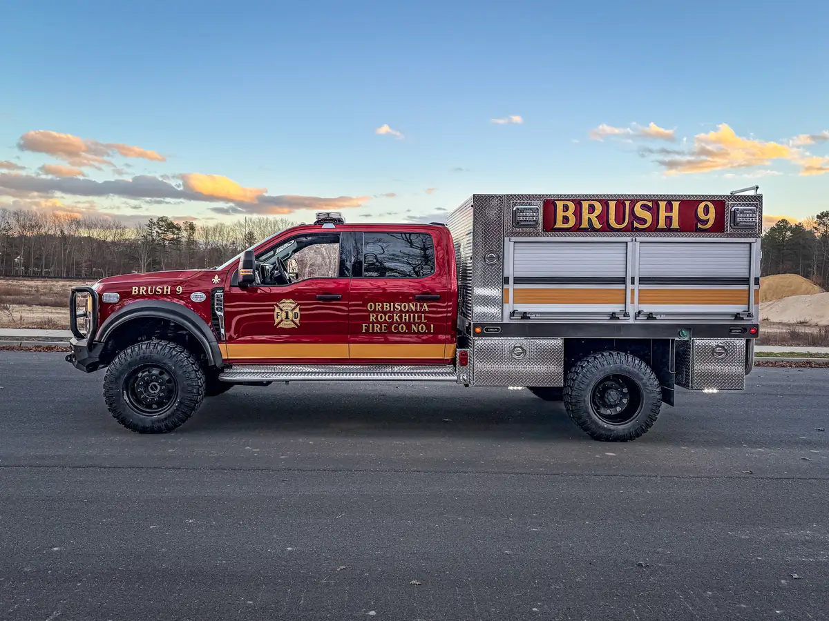 Driver-side profile with BRUSH 9 markings on body.