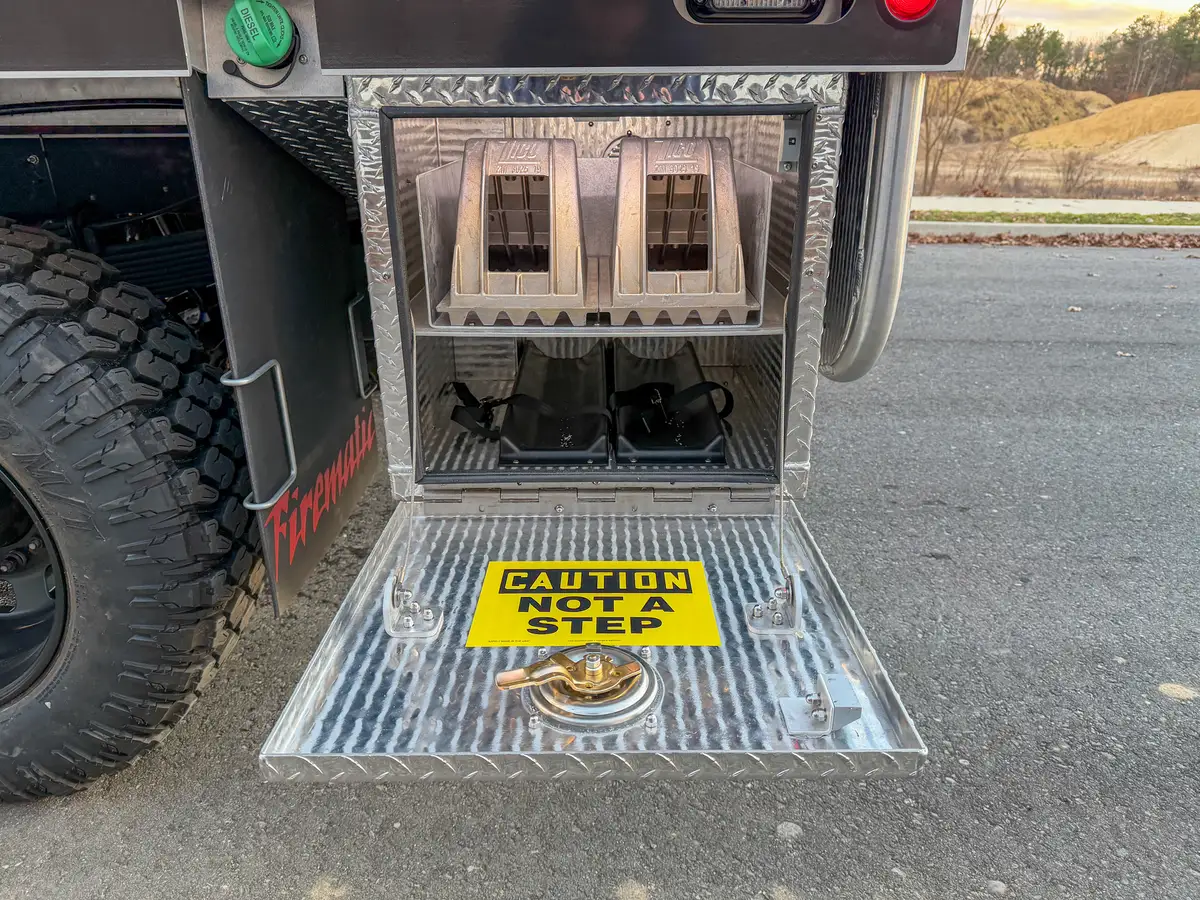 Lower side utility cubby with electrical outlets and ports.