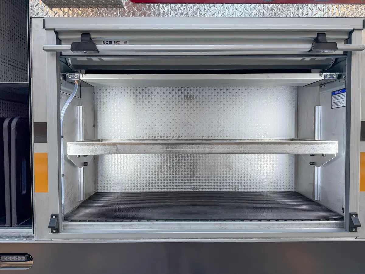 Open side bay with adjustable shelf rails and storage shelves.