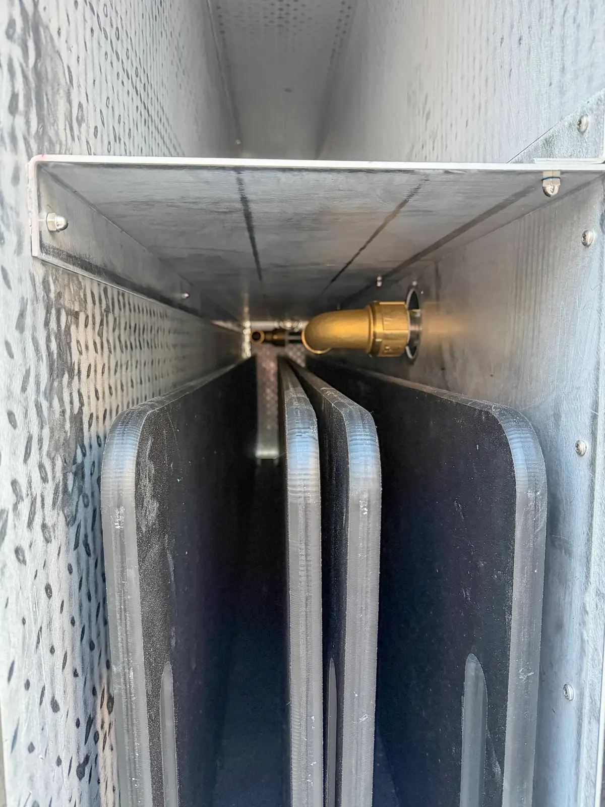 Long enclosed storage tube compartment inside side bay.
