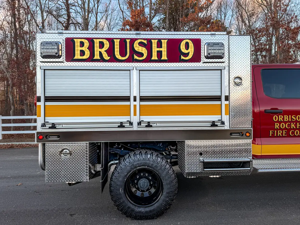 Driver-side body profile with BRUSH 9 panel and wheel arch.