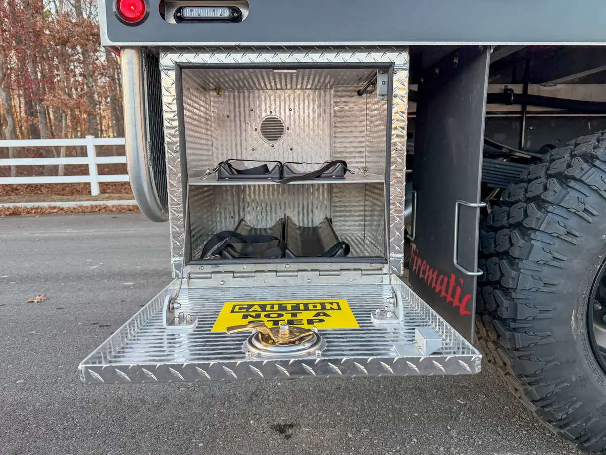 Open lower rear compartment with couplings and bracket mounts.