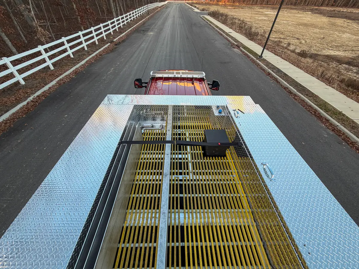 Top deck view looking forward over yellow grated walkway.
