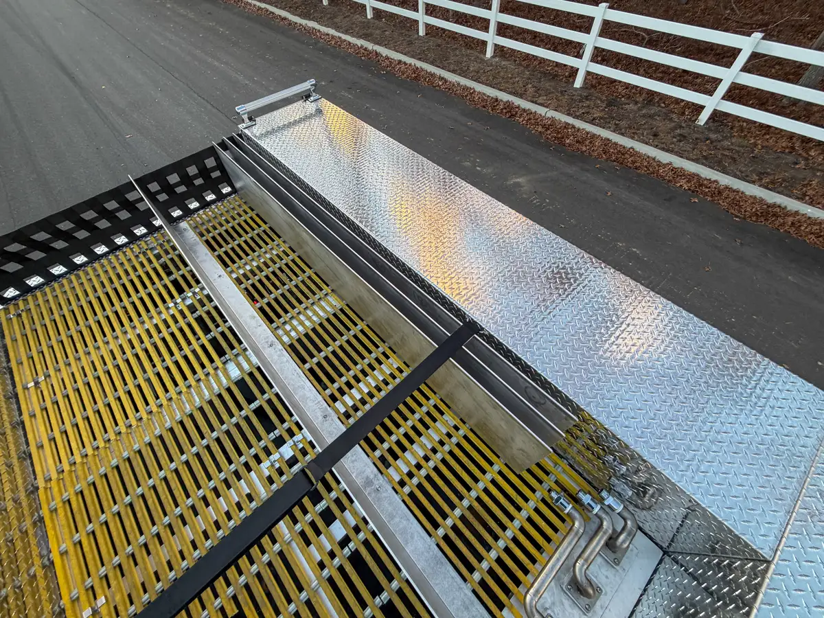 Upper side channel with yellow grating and aluminum walls.