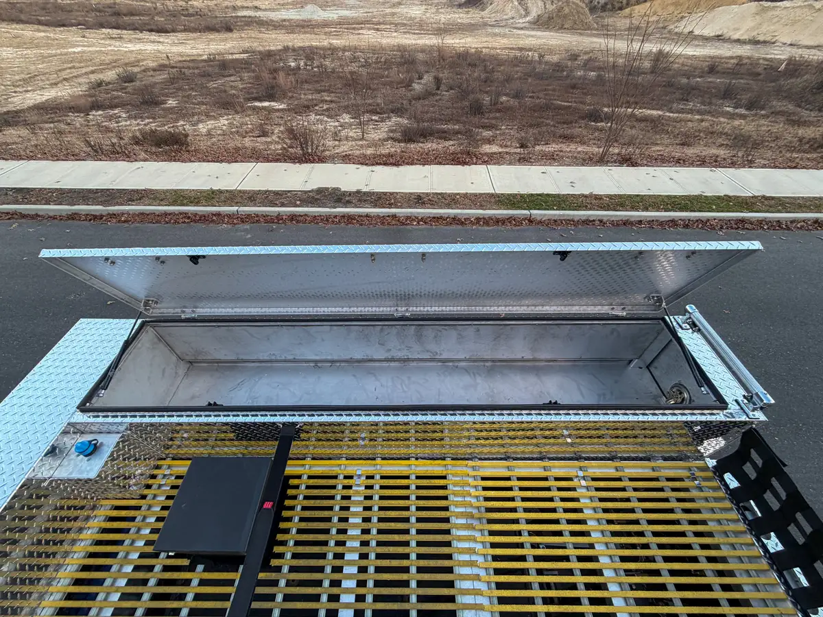 Open top hatch over grated deck compartment near rear.