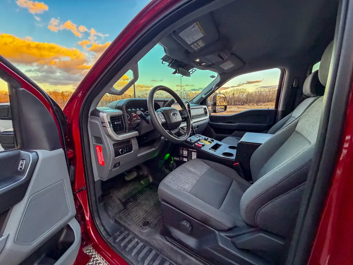 Front cabin view across dashboard and center controls.