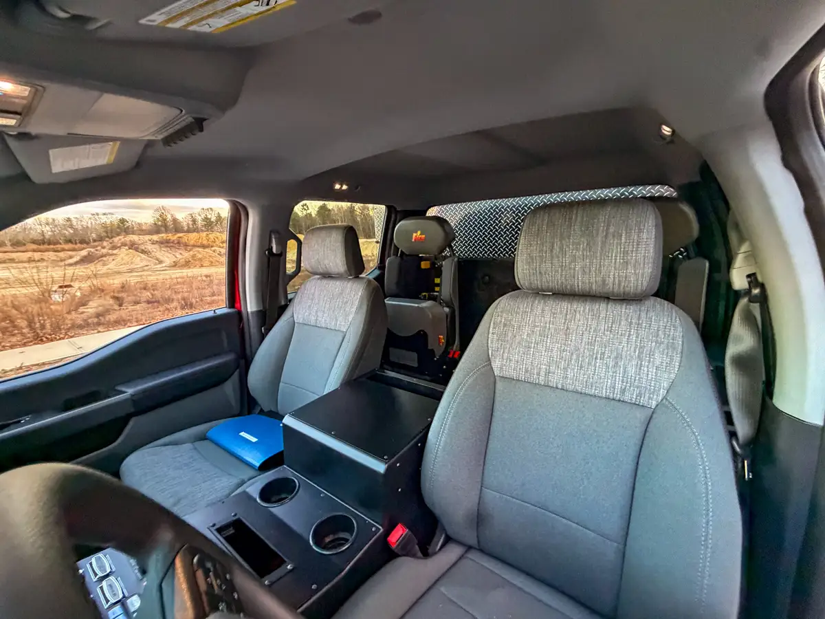 Passenger-side front seat and center console close view.