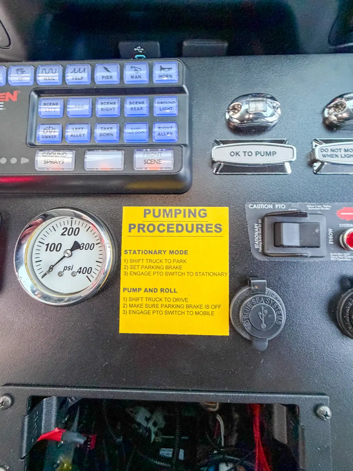 Tight view of dashboard gauge and labeled pumping procedures card.