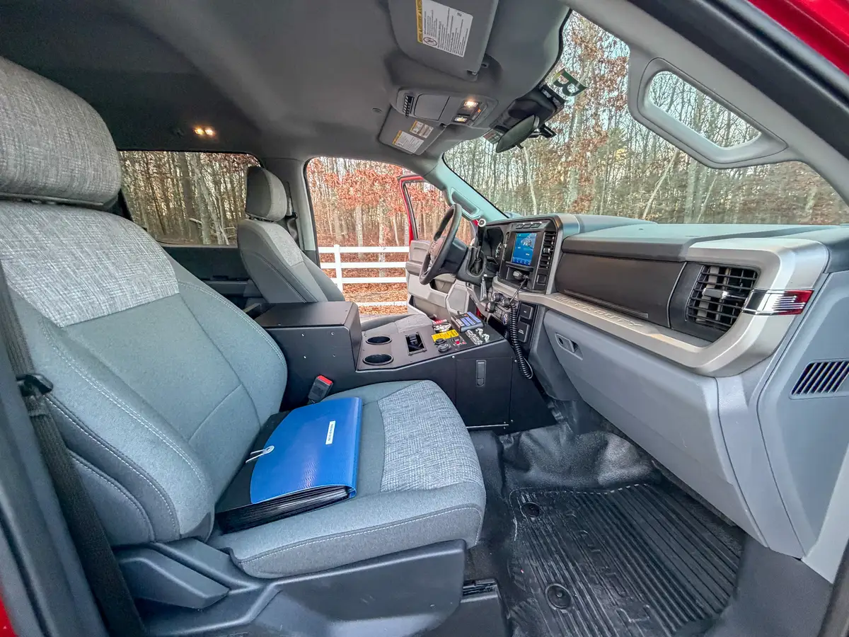 Cab interior from passenger side showing full dashboard layout.