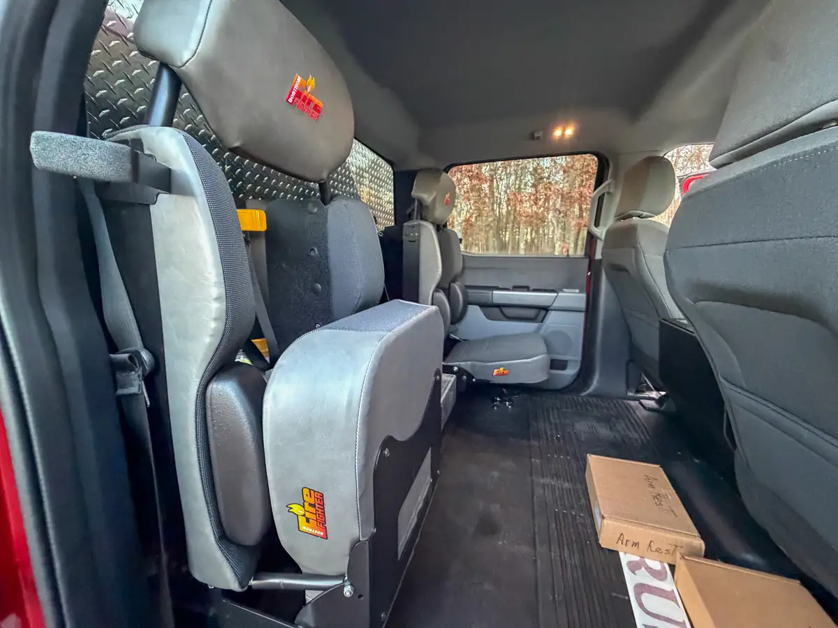 Rear cabin interior from side showing bench seating.