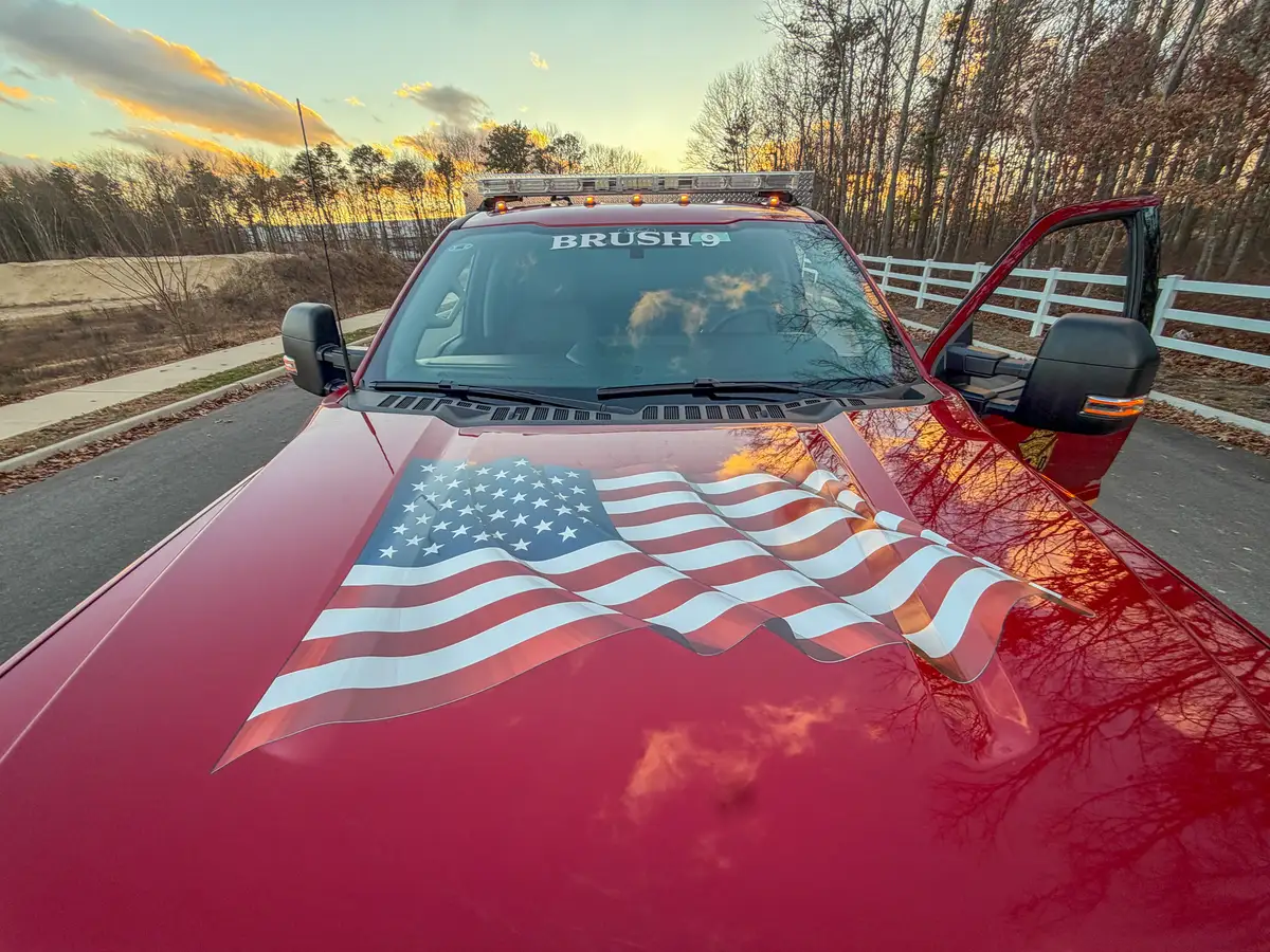 Hood close-up with American flag graphic and reflections.