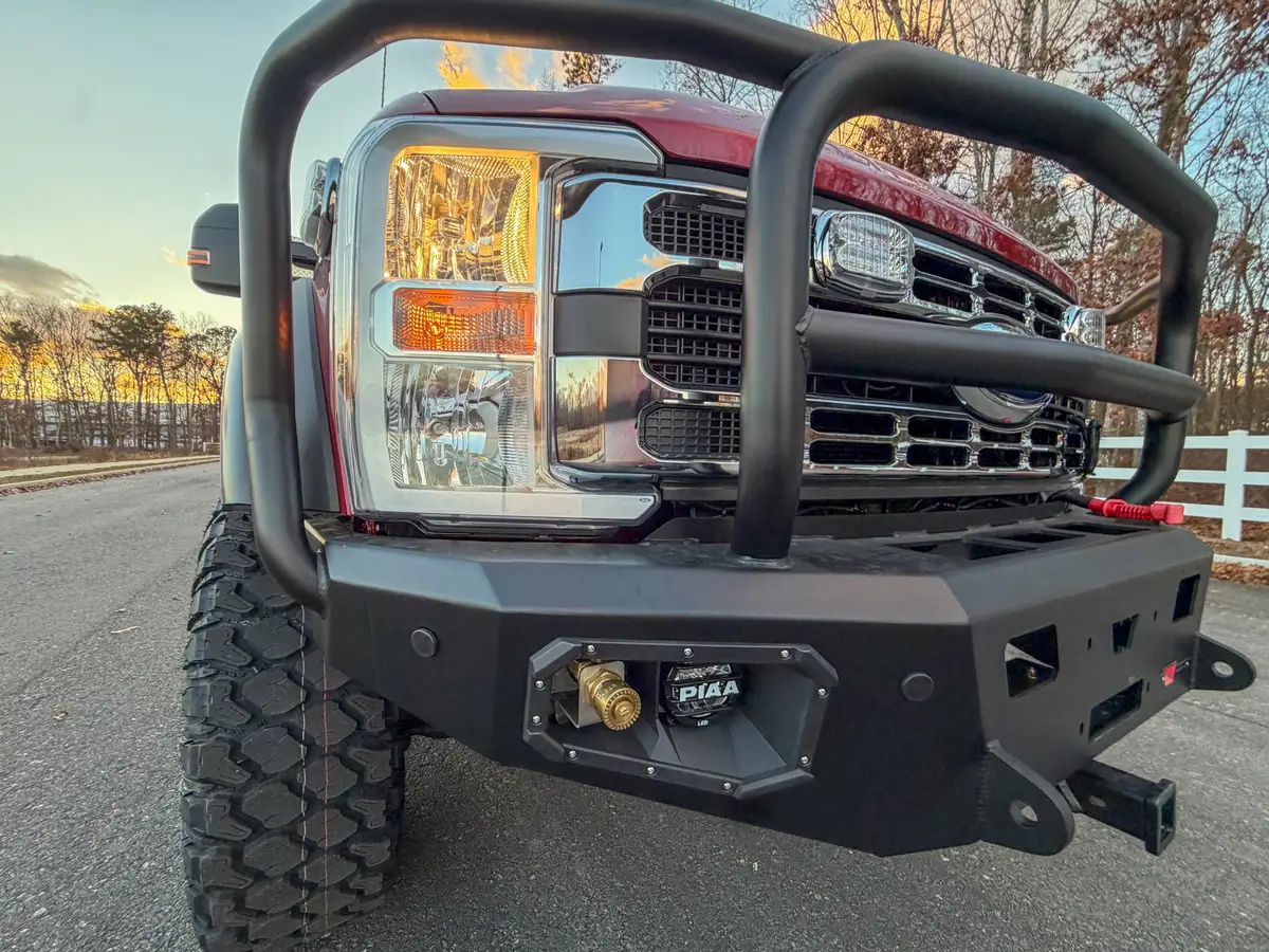 Front grille guard and left bumper corner close-up.