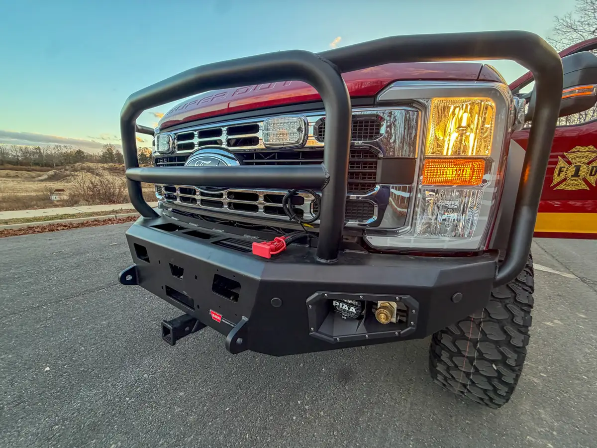 Front grille guard and right bumper corner close-up.