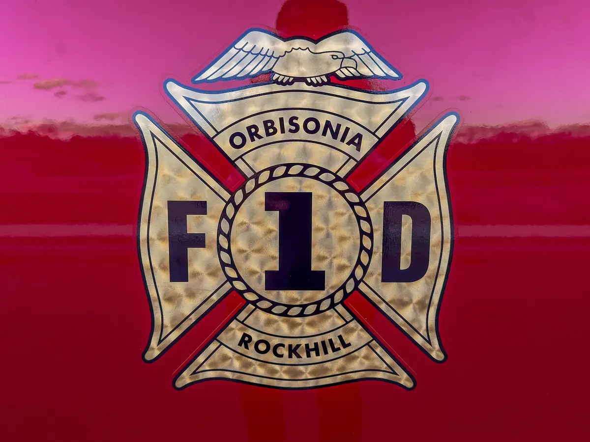 Close-up of Orbisonia Rockhill fire company crest on red panel.