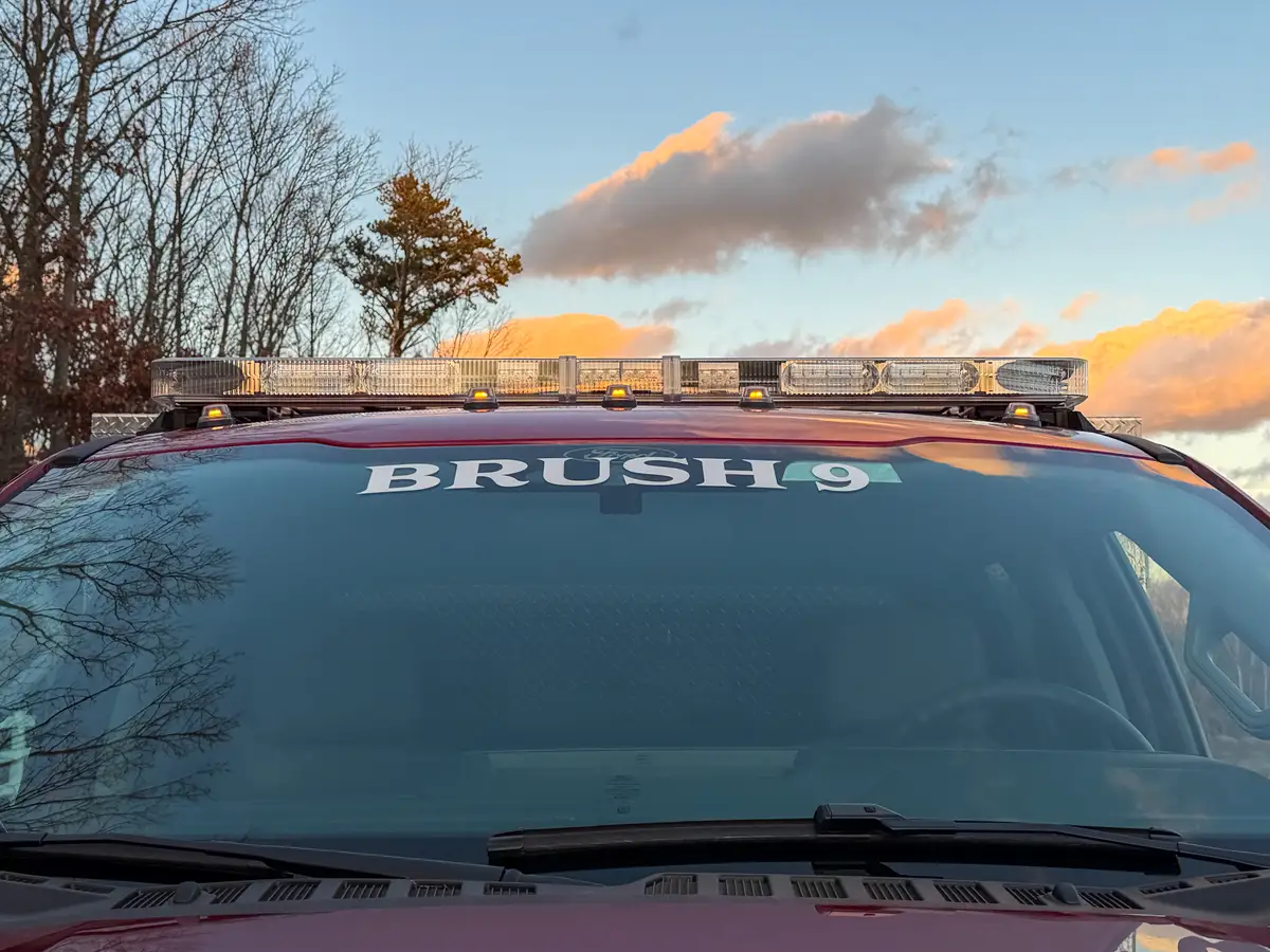 Windshield banner close-up with BRUSH 9 text.