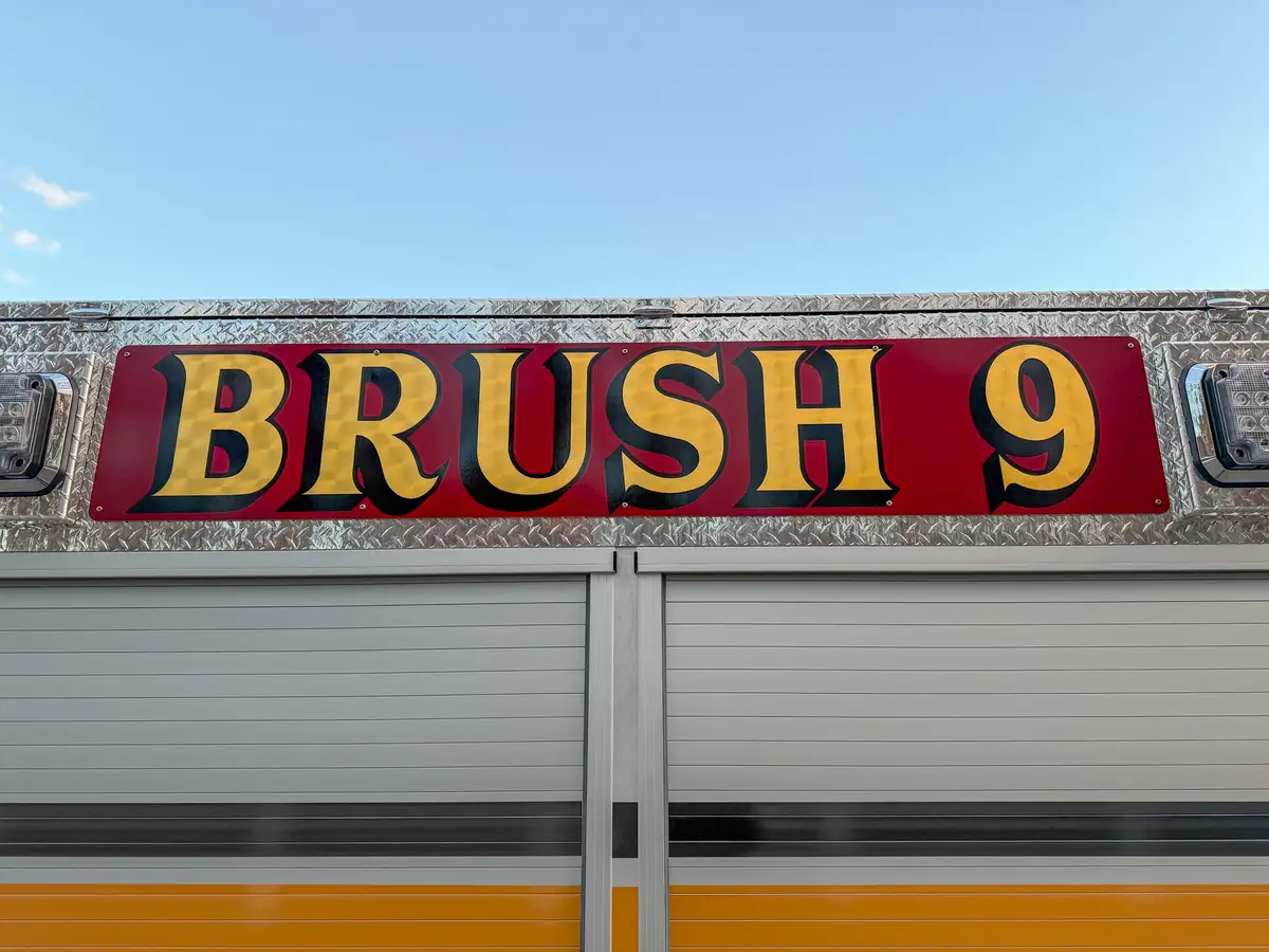 Body side sign close-up with BRUSH 9 lettering.