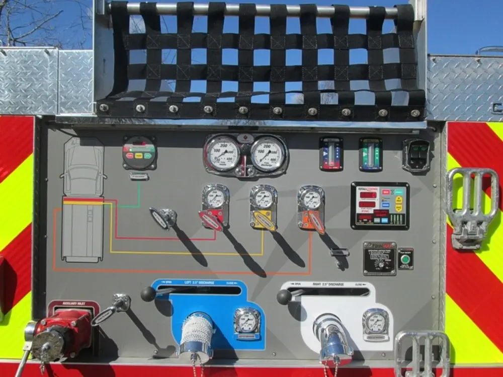 Exterior view of small fire truck showing cab, body compartments, and wheel/tire area.