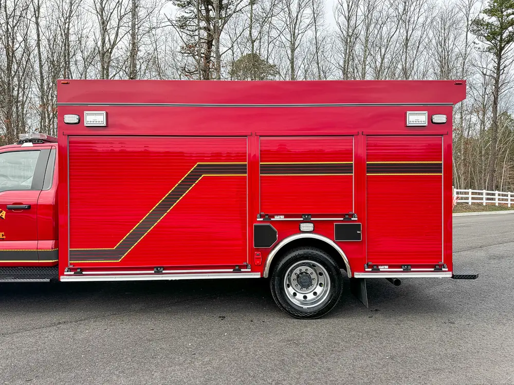 Close side view of right body compartments and rear wheel area.