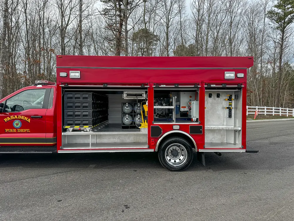 Right-side compartment bay opened, showing storage and equipment.