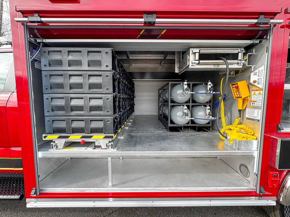 Large side compartment interior with bottle rack and storage modules.