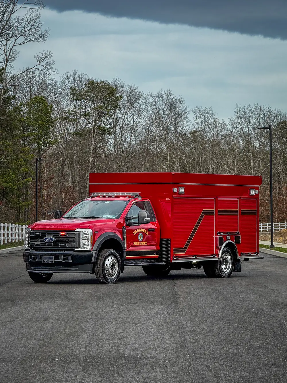 Wide front-left exterior view of red BRAT truck.