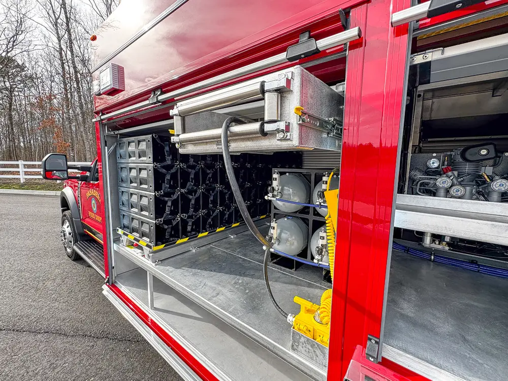 Open right-side bay showing extended bottle rack and adjacent equipment bay.
