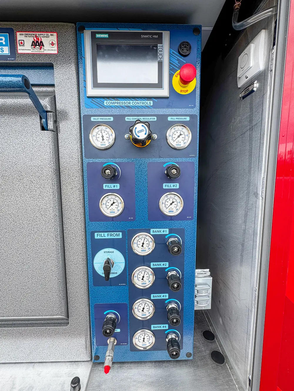 Close view of blue control panel with gauges and screen.