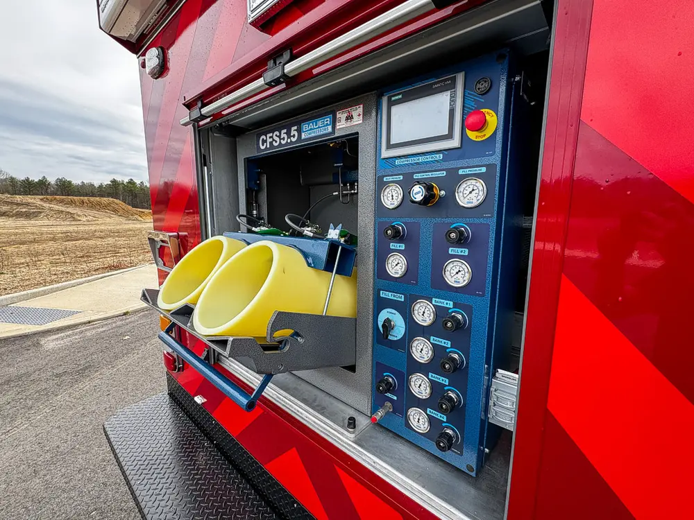 Angled view of fill station controls and extended yellow sleeves.