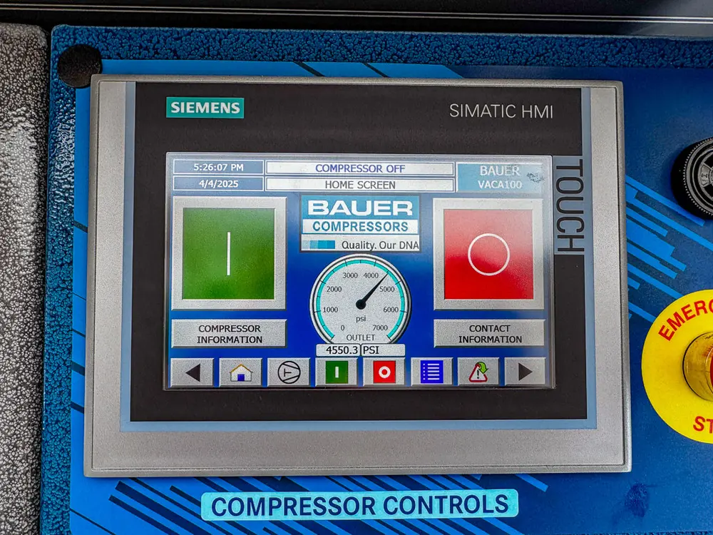 Close-up of Siemens touch screen on compressor control panel.