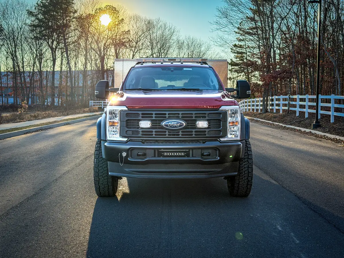Head-on front view showing grille, bumper, and off-road tires.