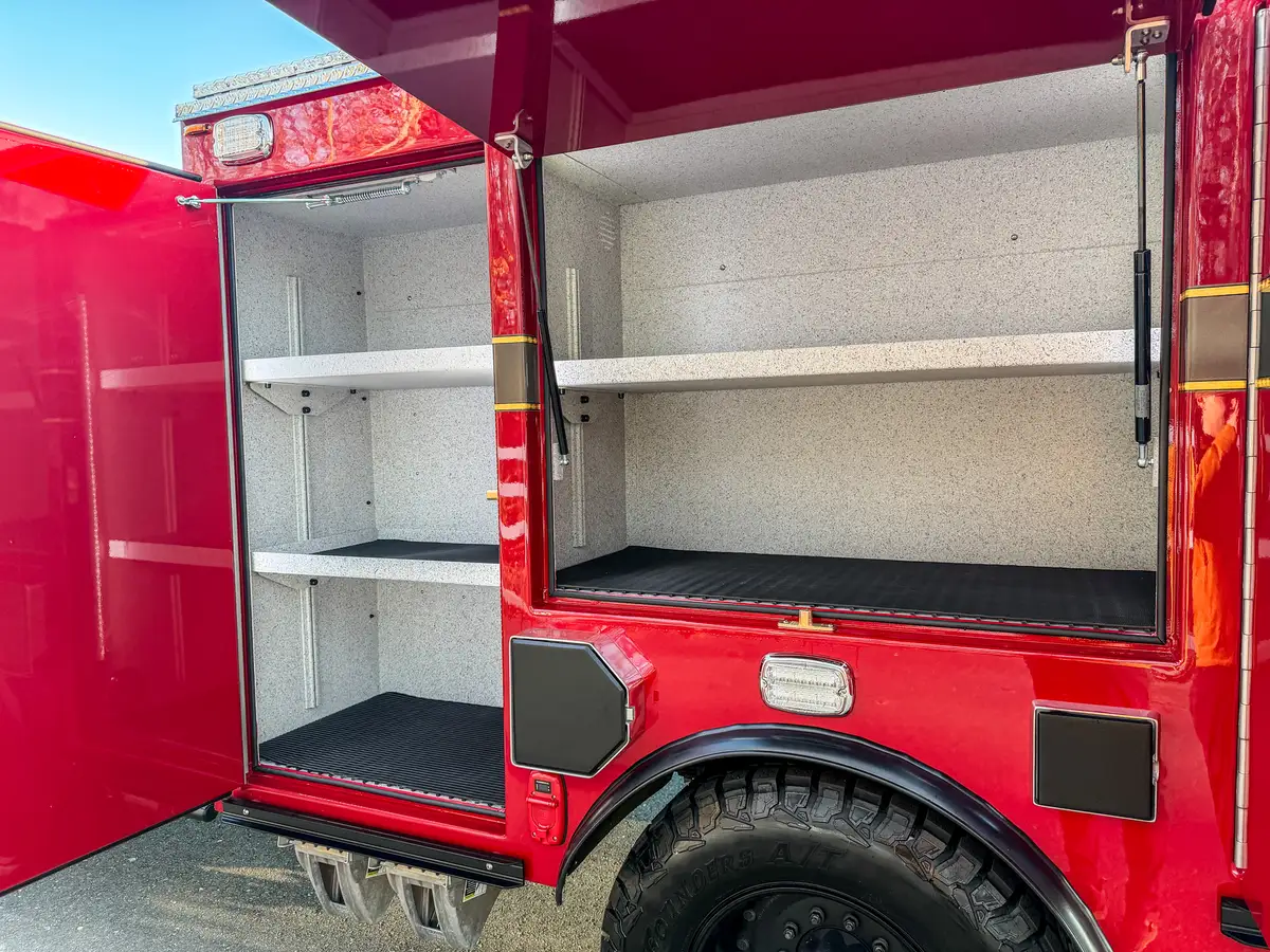 Two open side compartments showing empty shelves and storage space.