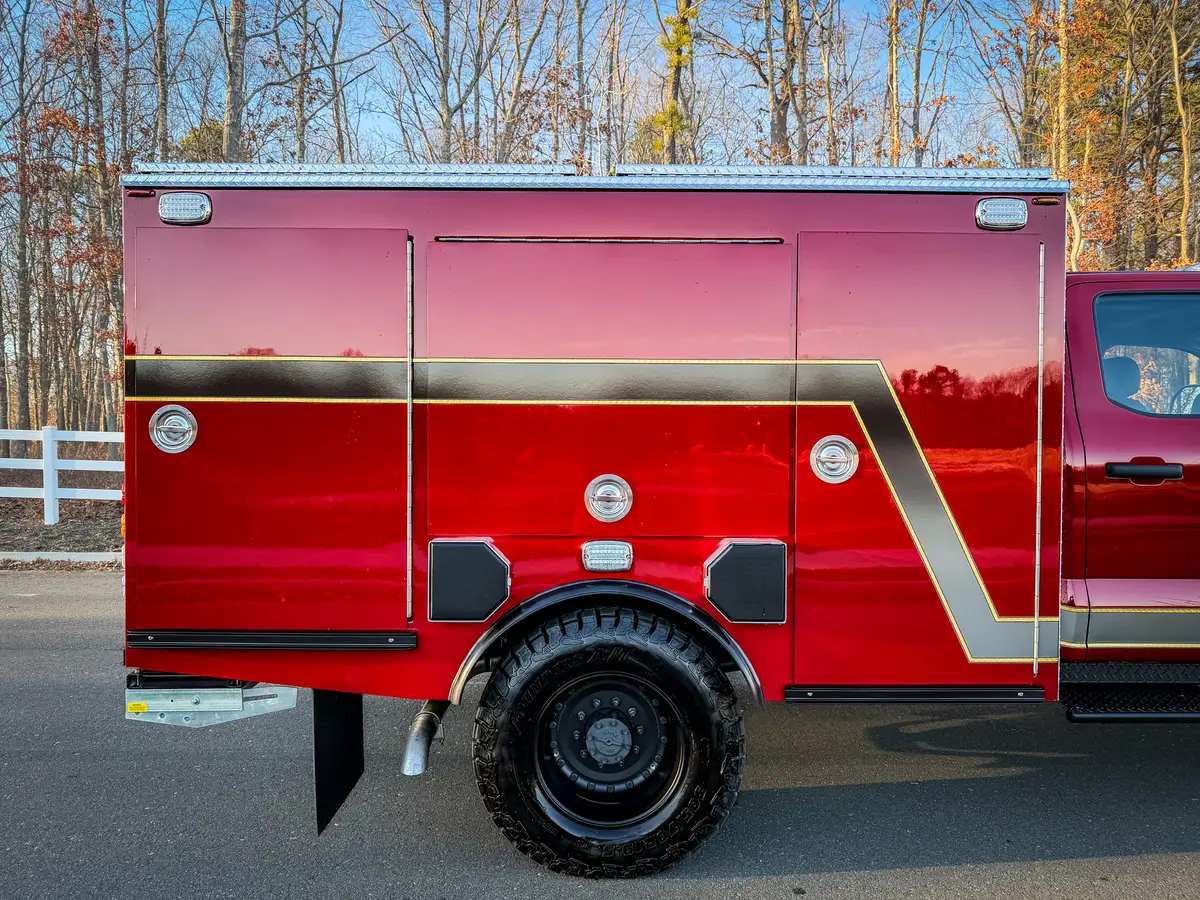 Left-side body close-up with compartment doors closed.