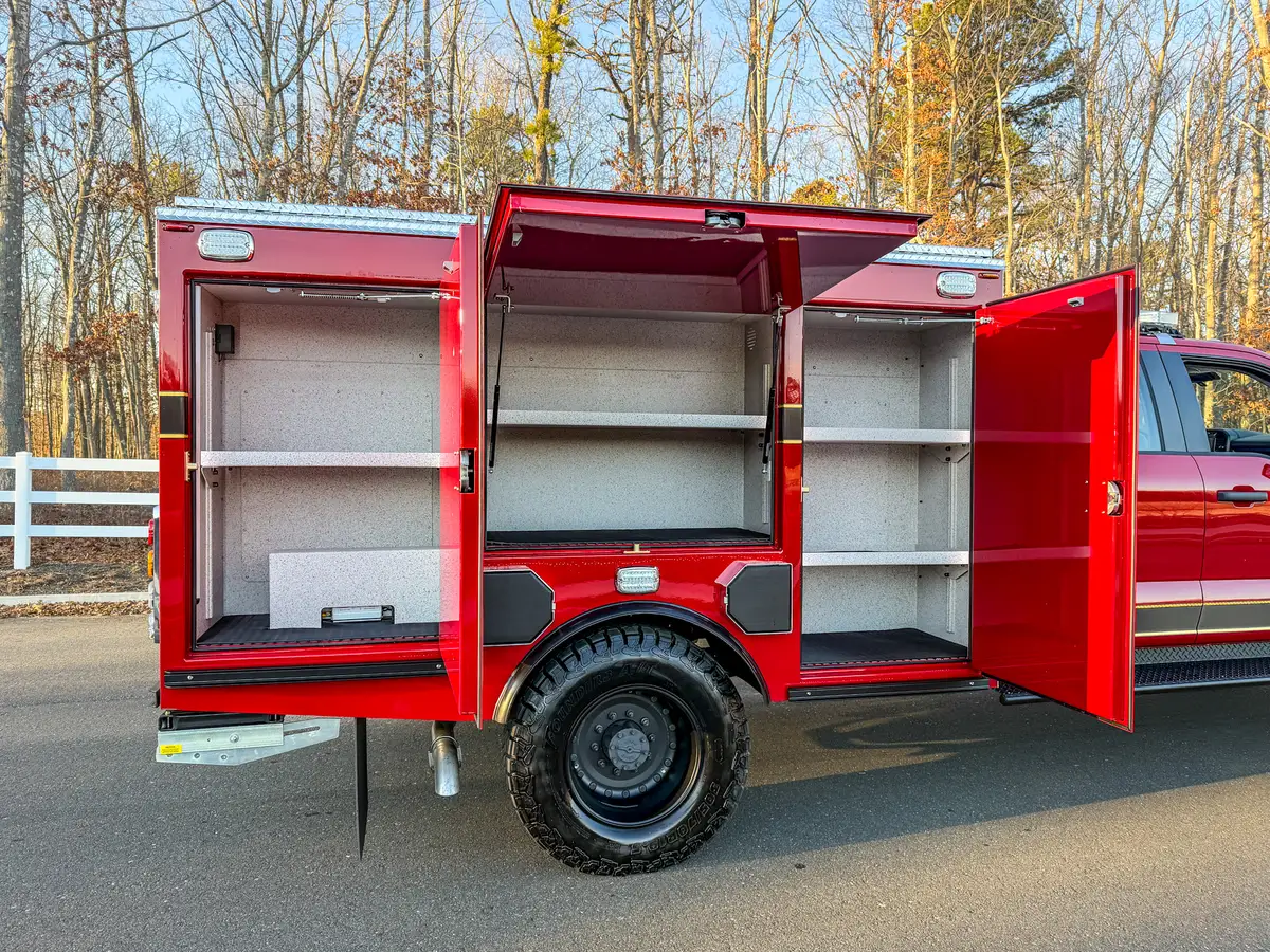 Left-side compartments open, revealing empty shelves across three bays.