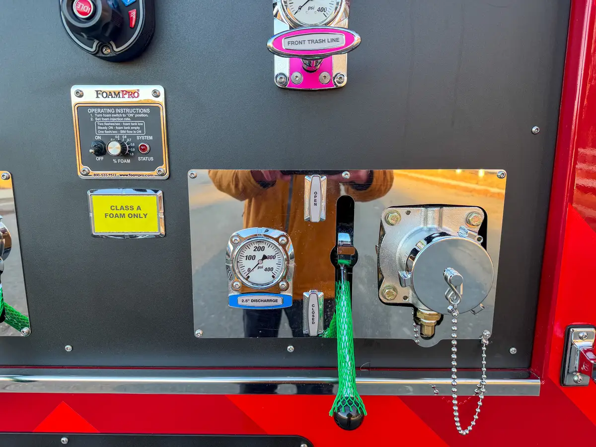 Right lower pump panel close-up with discharge control and capped outlet.