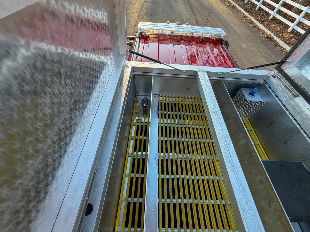 Top tank compartment view toward cab with grating and internal walls.