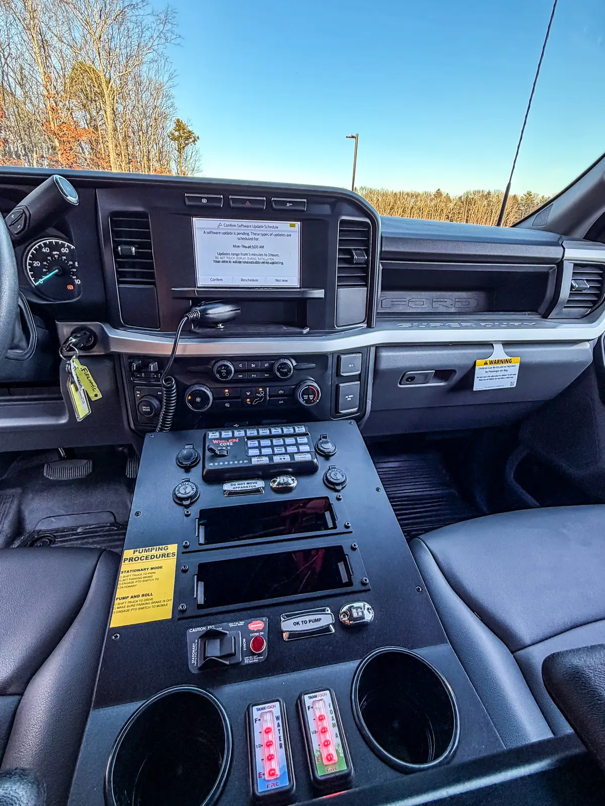 Centered dashboard and center-console view with screen, radio, and control panel.