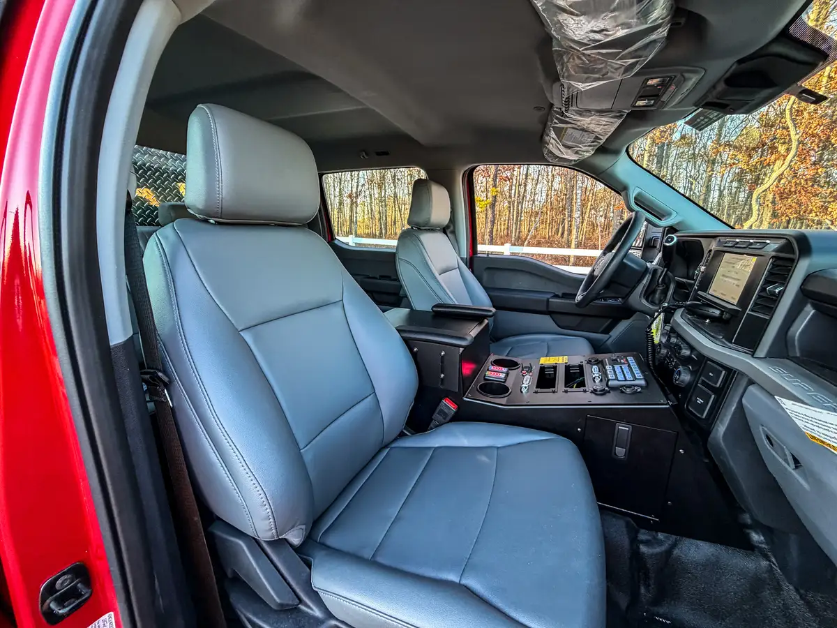Interior close view of both front seats and center console controls.
