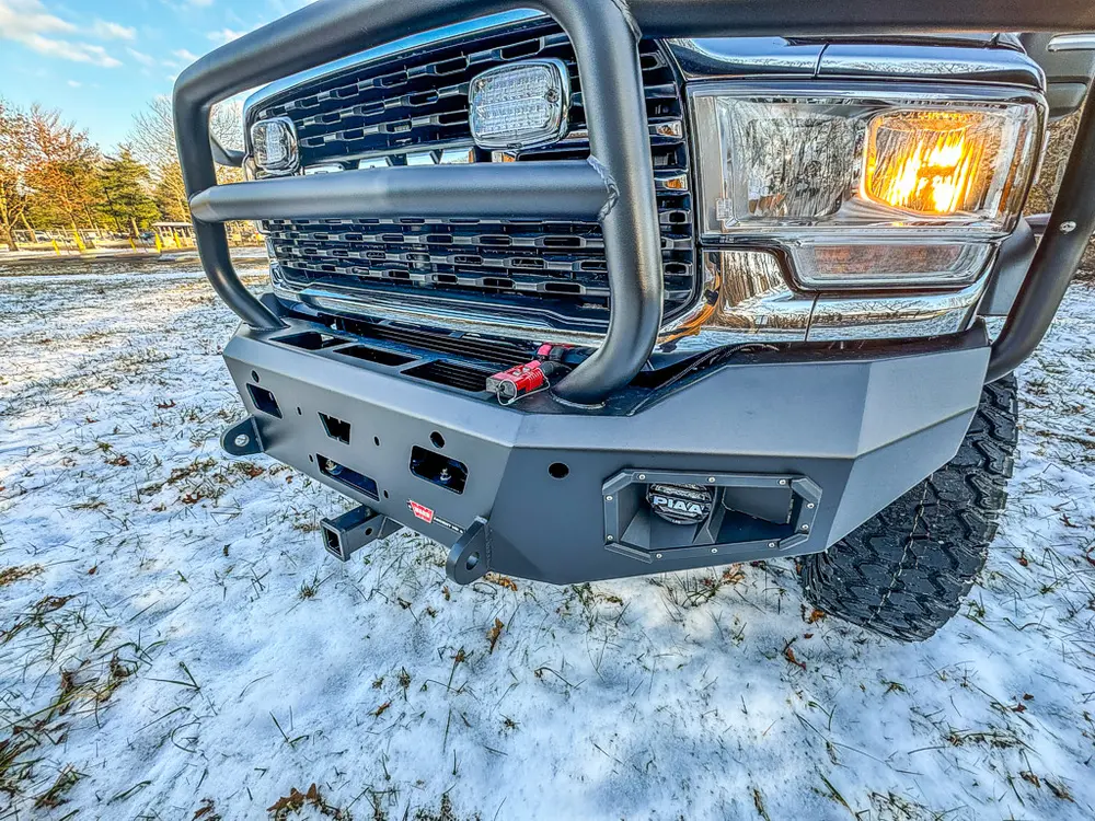 Front bumper and grille close-up from the left front corner.