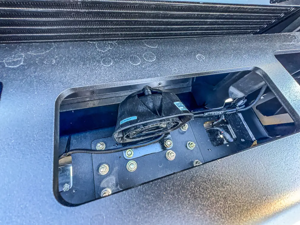 Close-up of the front bumper winch and fairlead assembly.