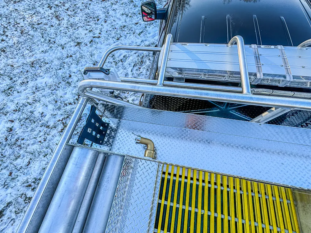 Elevated view of the upper deck, railings, and grated walkway.