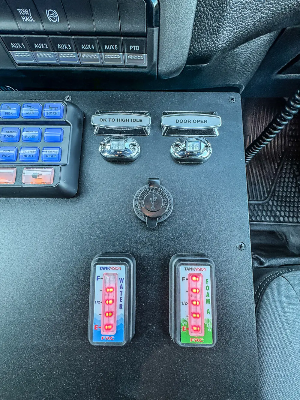 Close-up of dashboard switch panel and ignition area.