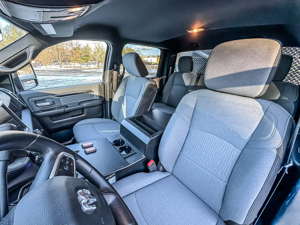 Front seating area view with driver and passenger seats and center console.