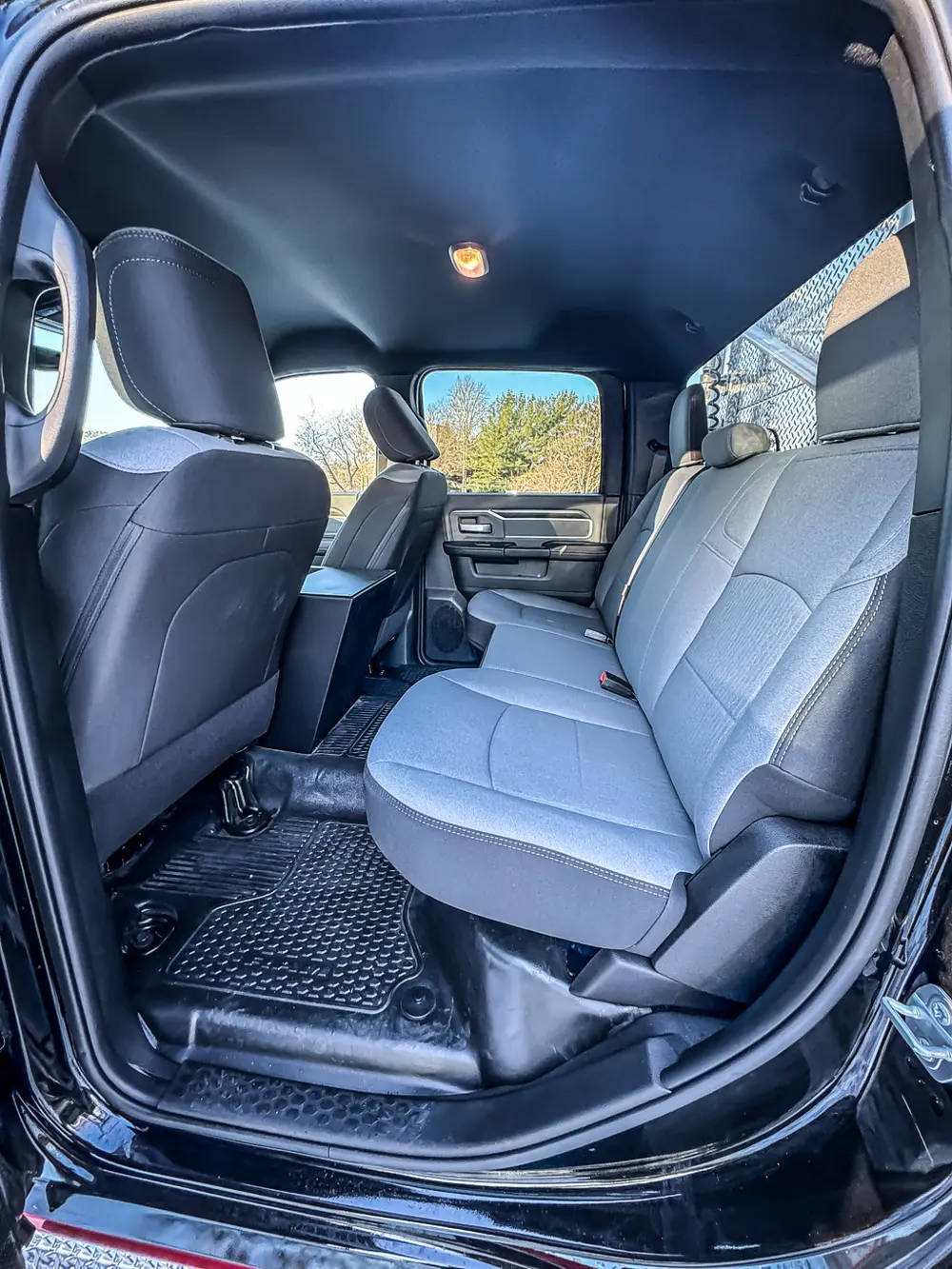 Rear cab seating view from an open side door.