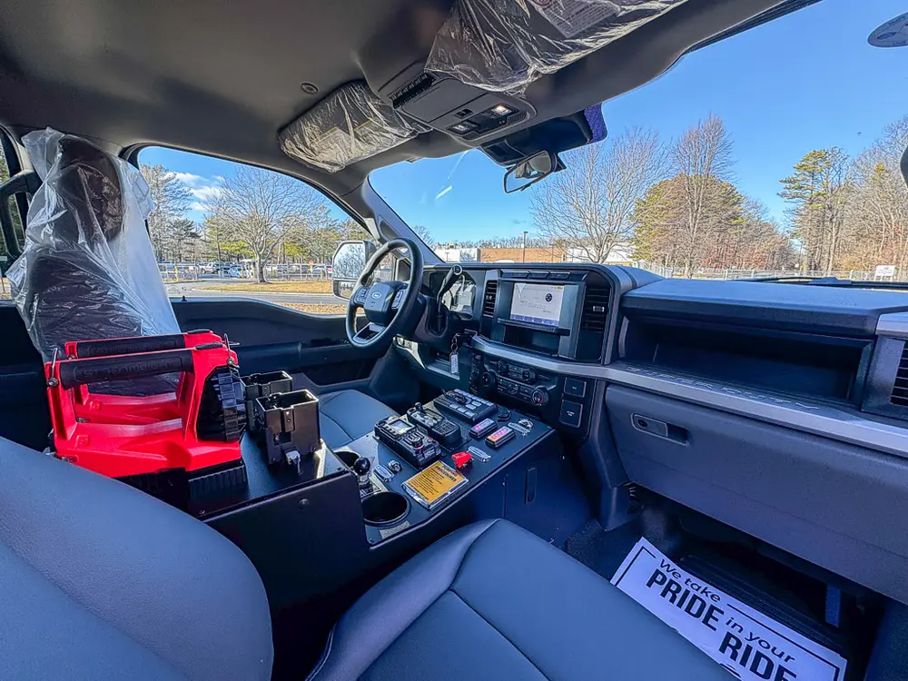Passenger-side dashboard and center console view across the cab interior.