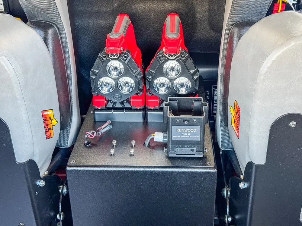 Center rear console close-up with mounted red controls between seats.