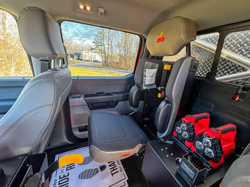 Rear side seating area with equipment bag on the floor by the seat.