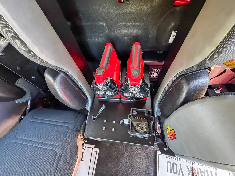 Close-up of center rear console with dual red control handles.