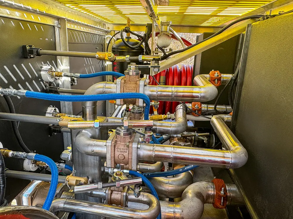 Close-up inside the pump area with valves, pipes, and control components.