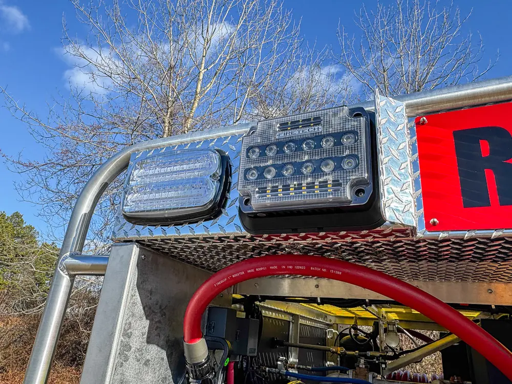 Upper rear corner close-up with light cluster and body rail.